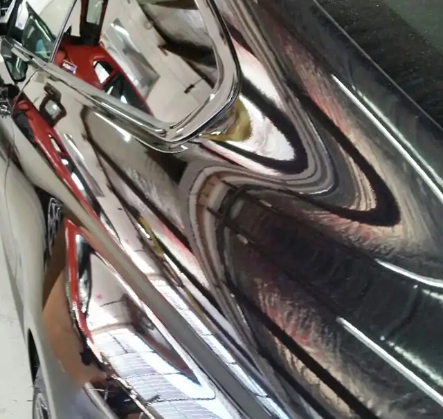 Side panel dent repair showing successful PDR treatment