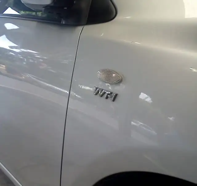 Vehicle wing dent repair before and after comparison