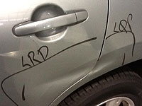 Car dent located on panel seam that cannot be repaired with paintless dent removal